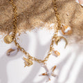 Collier acier inoxydable doré mer étoile dauphin coquillage
