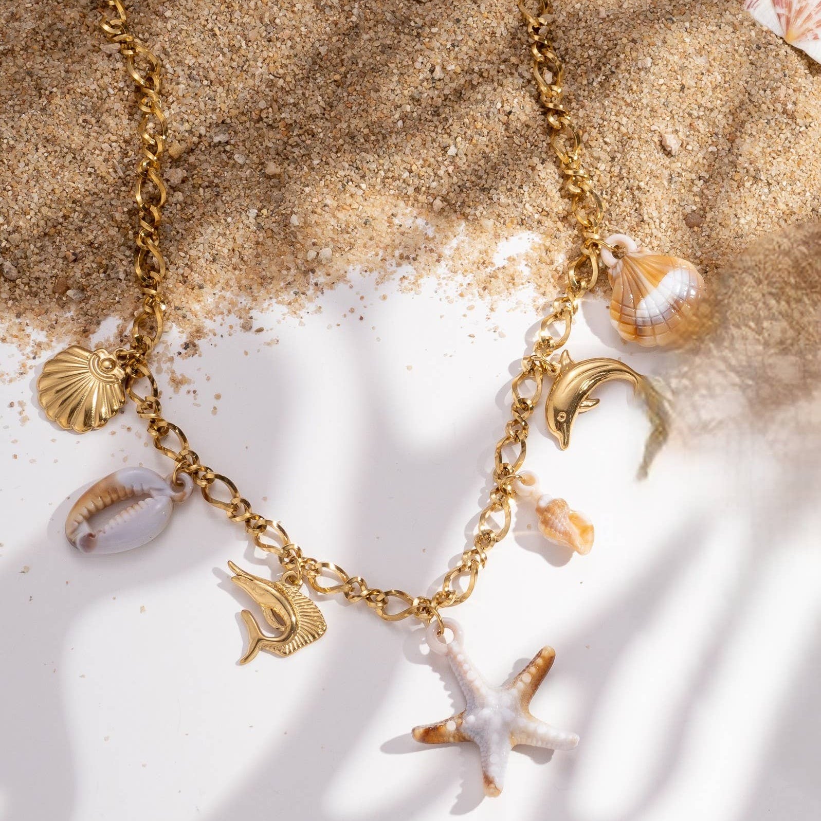 Collier acier inoxydable doré mer étoile dauphin coquillage